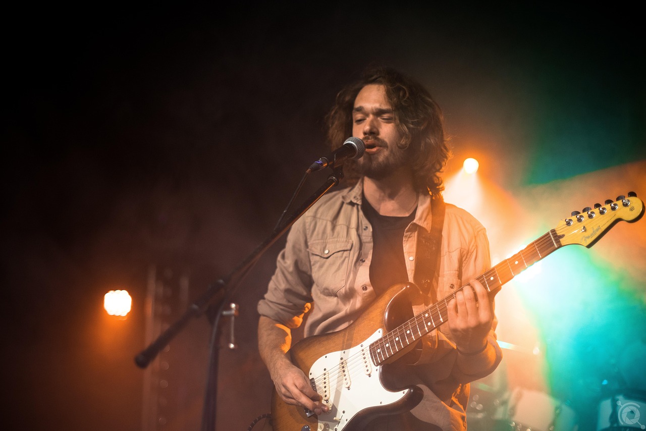 Musician performing with guitar